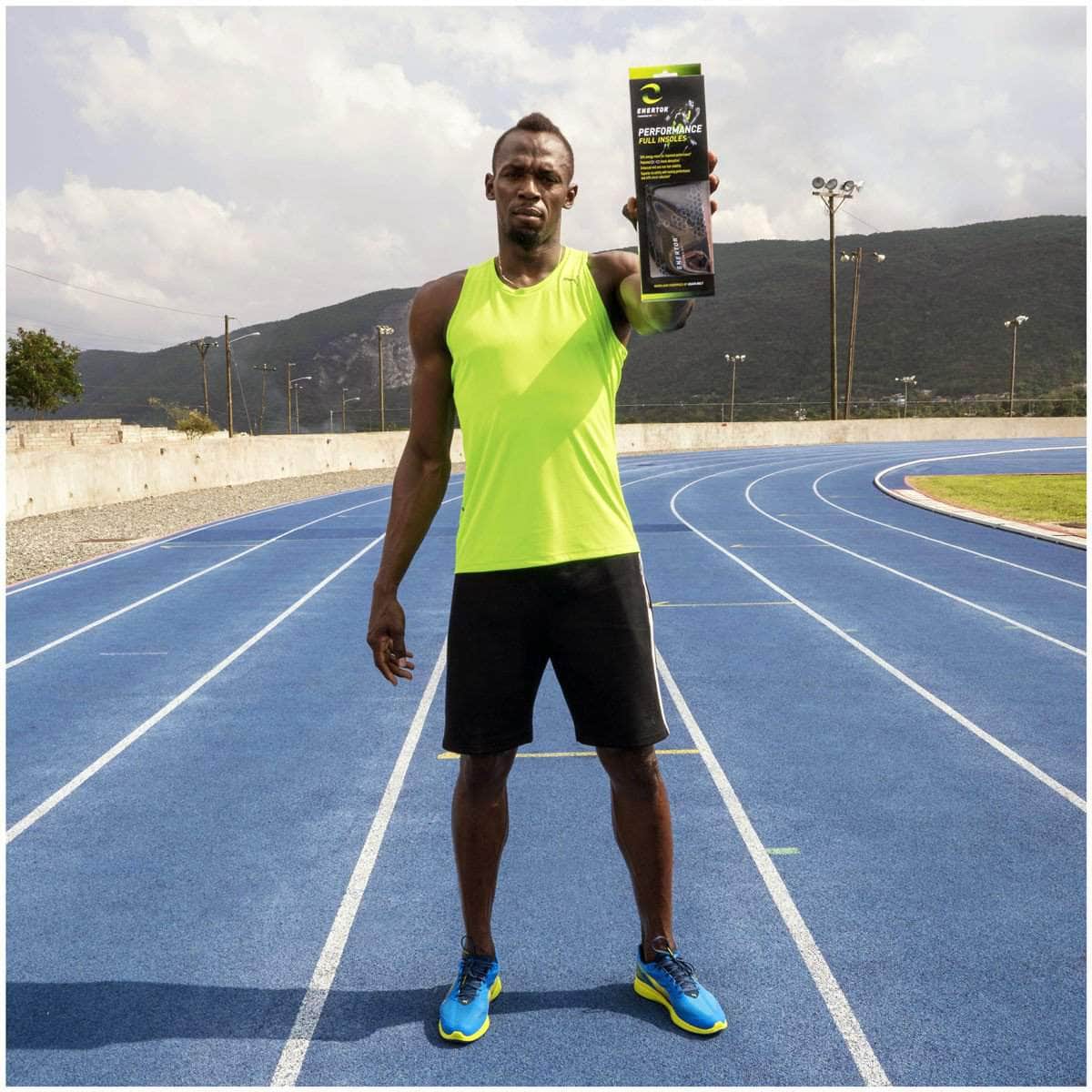 Usain Bolt holding package of Enertor insoles